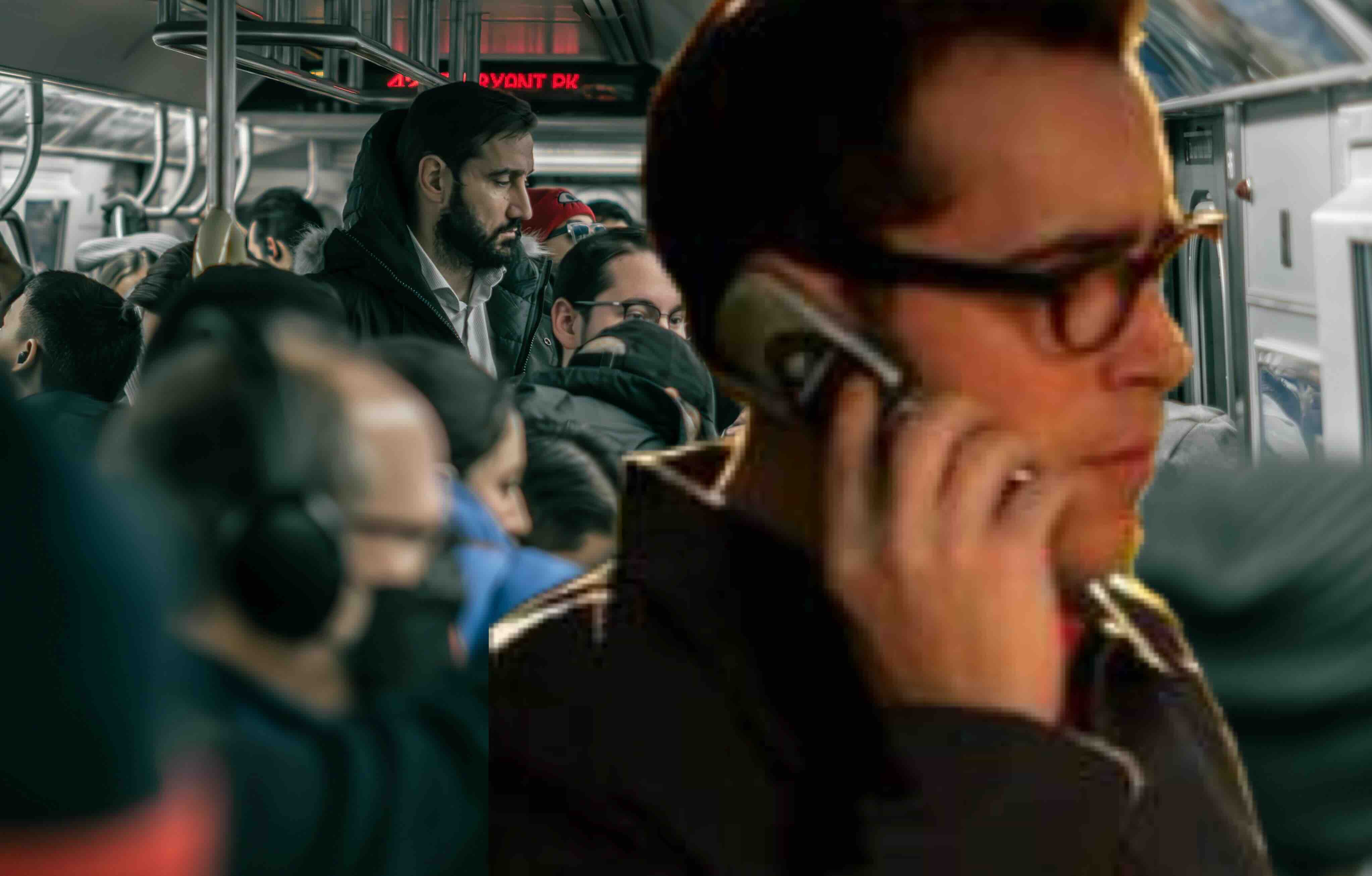 Crowded subway car with passengers